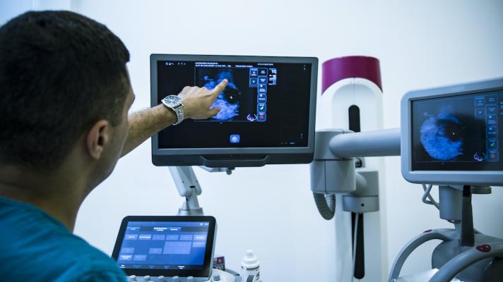 Doctor looking at mammogram
