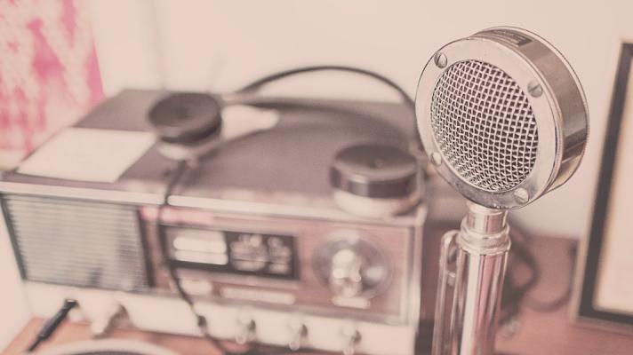An old-timey microphone and radio setup represent our weekly digital health podcast